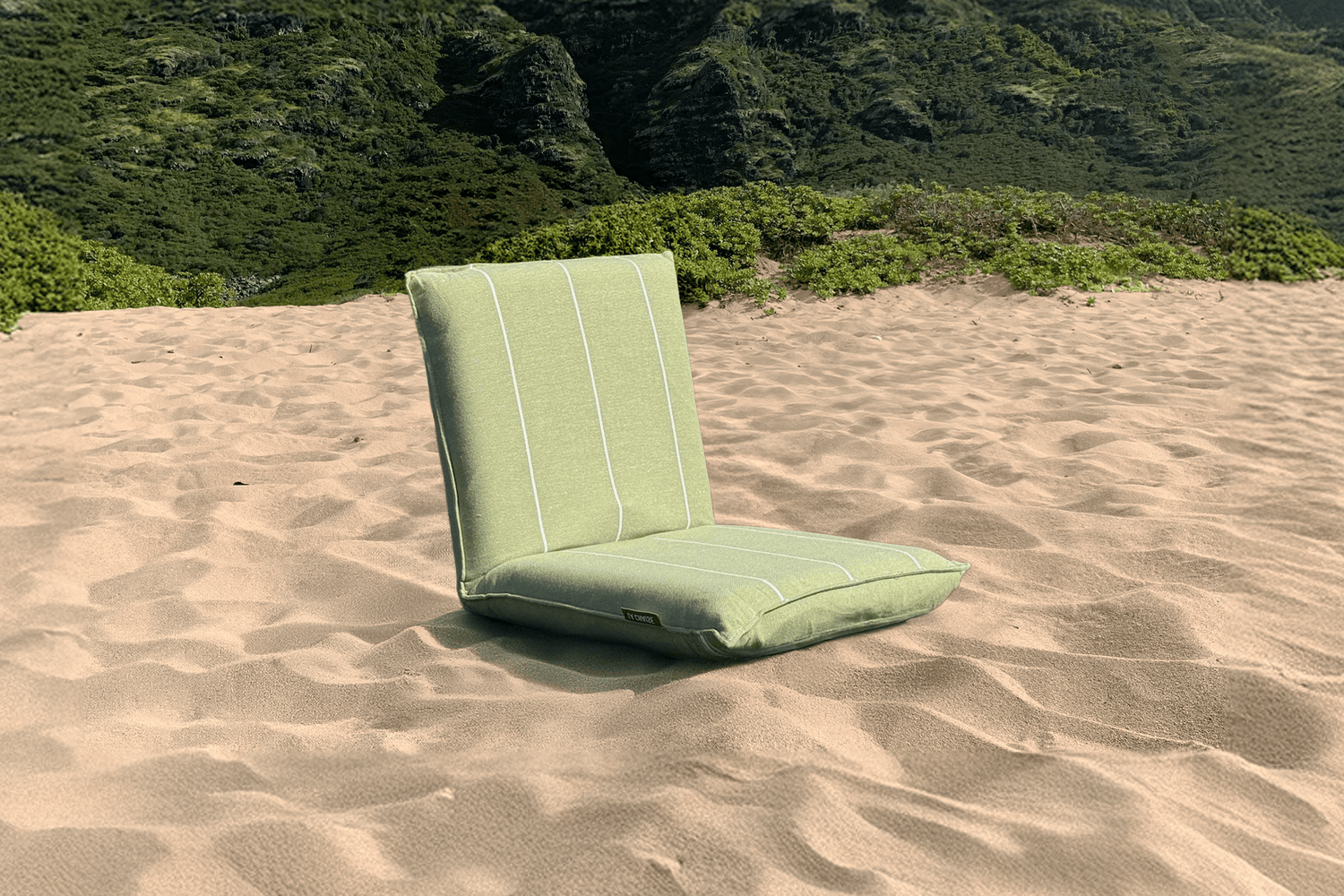 Lightweight foldable beach chair in green with padded back — modern, portable, and comfortable