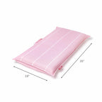 Folded pink beach chair with dimensions 35 inches by 19 inches displayed