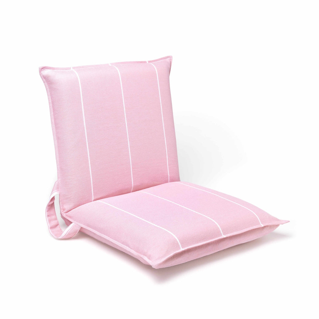 Angled view of a compact pink outdoor chair for the beach or park