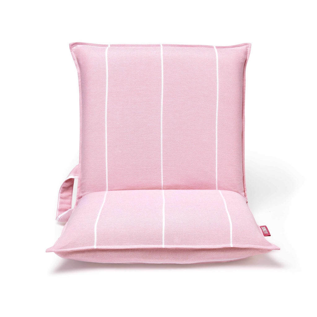 Front view of a lightweight pink beach chair with padded seat and white stripe design