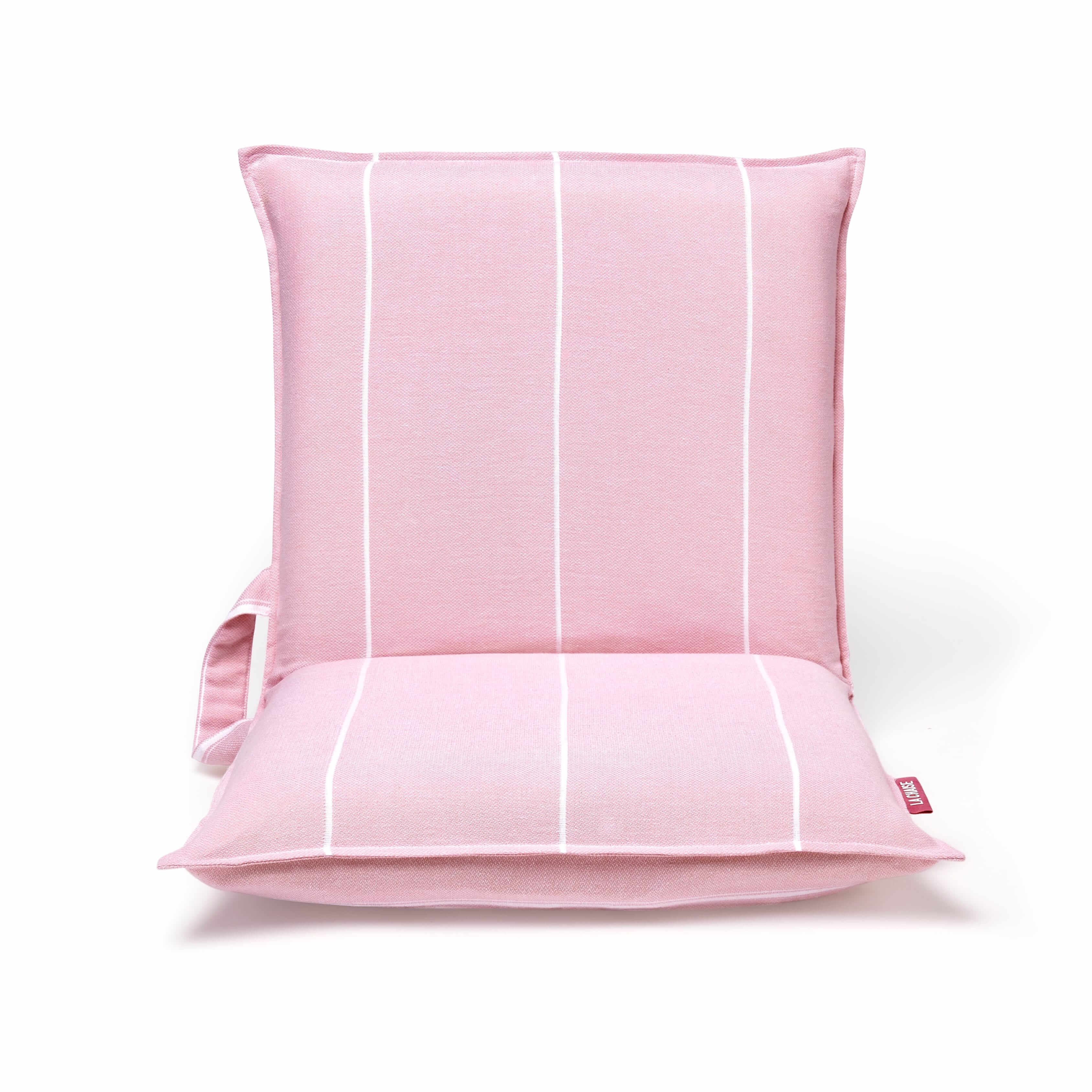 Front view of a lightweight pink beach chair with padded seat and white stripe design