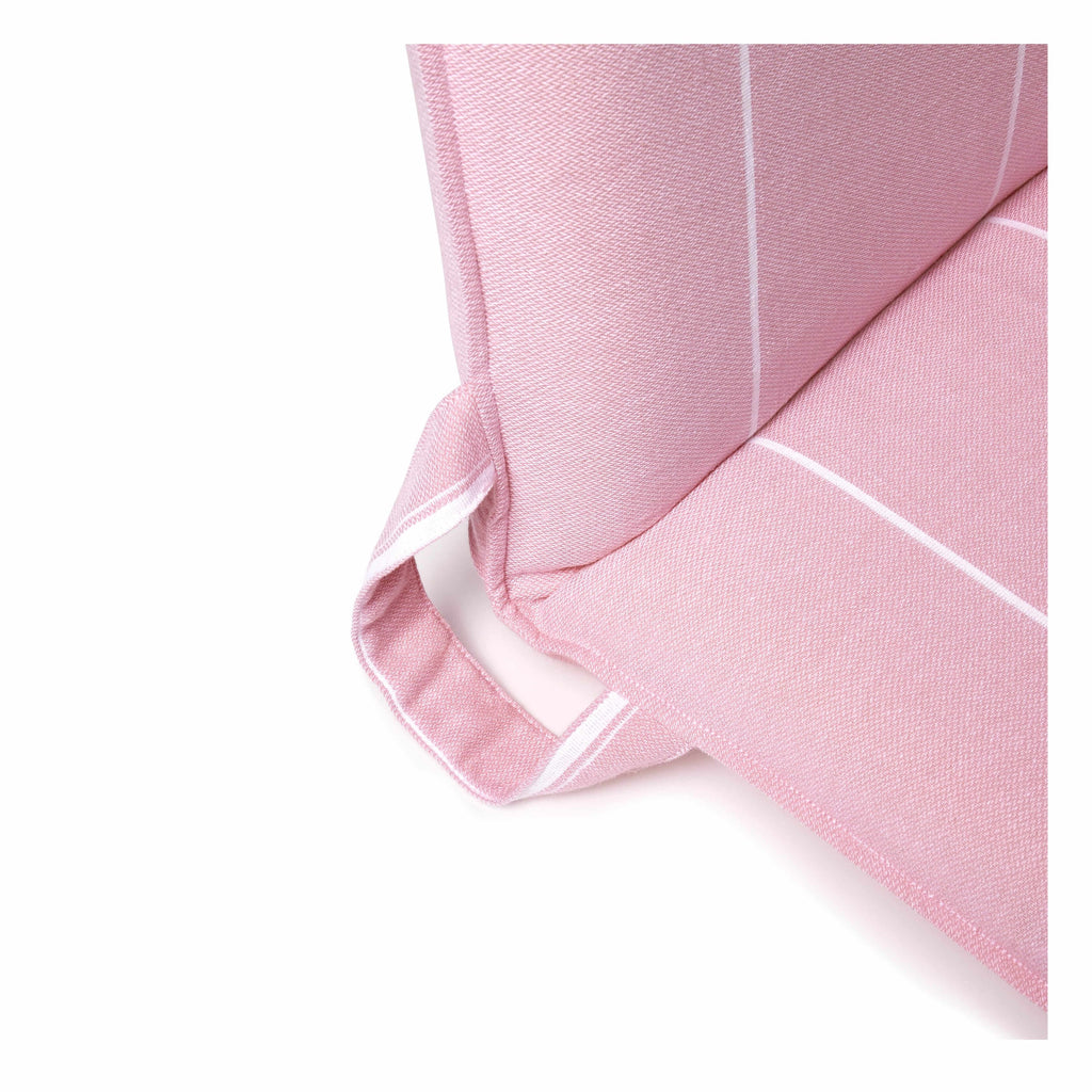Close-up of a pink folding beach chair with cushioned fabric and carry handle