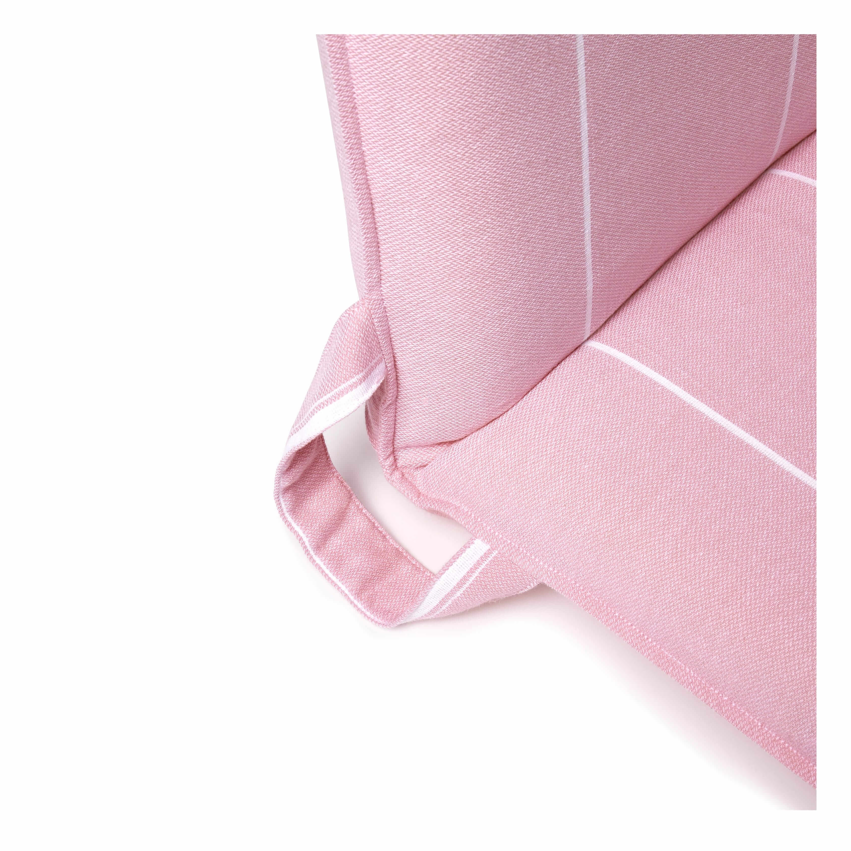 Close-up of a pink folding beach chair with cushioned fabric and carry handle